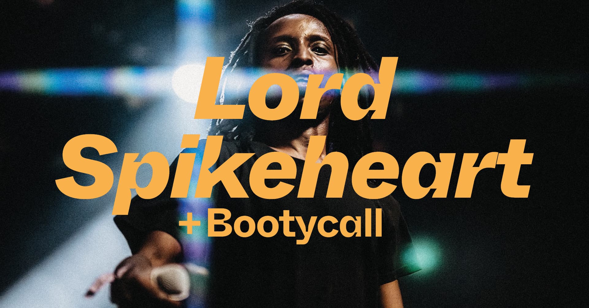 A man holding a microphone is overlaid with the text "Lord Spikeheart + Bootycall" in bold, orange letters.