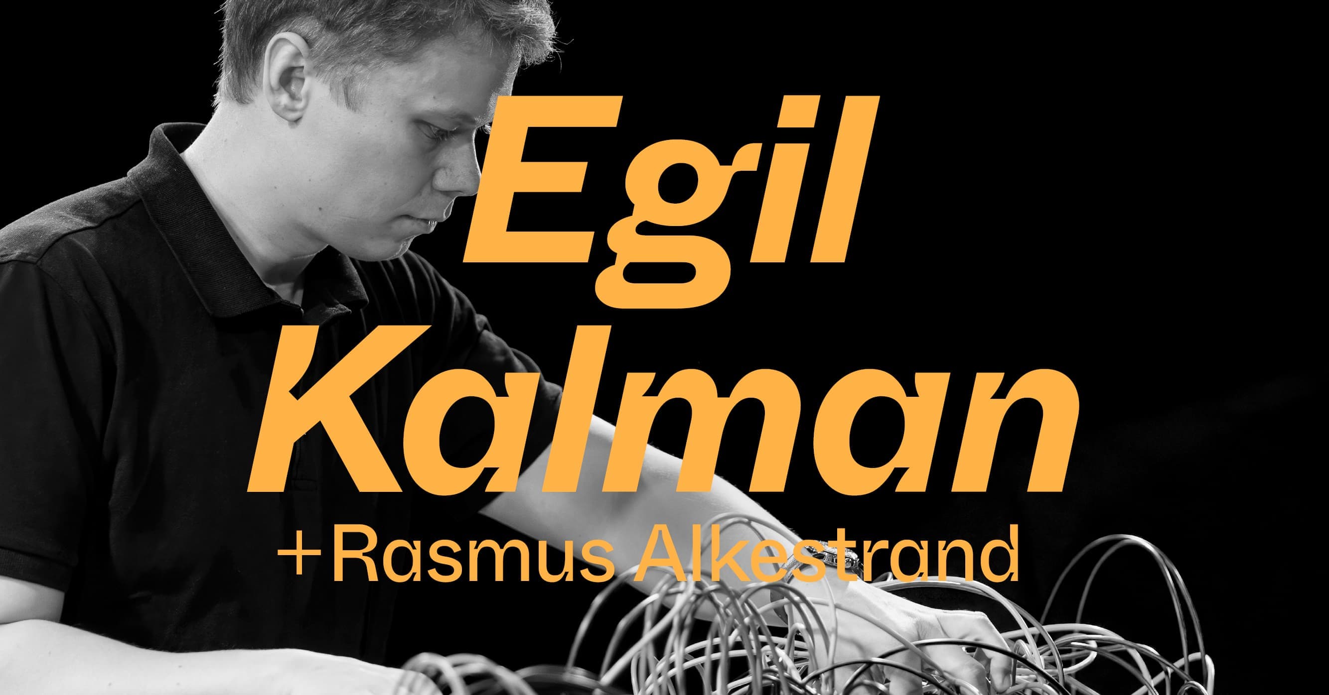 A man is adjusting wires on a modular synthesizer, with the text "Egil Kalman + Rasmus Alkestrand" overlaid in large letters.